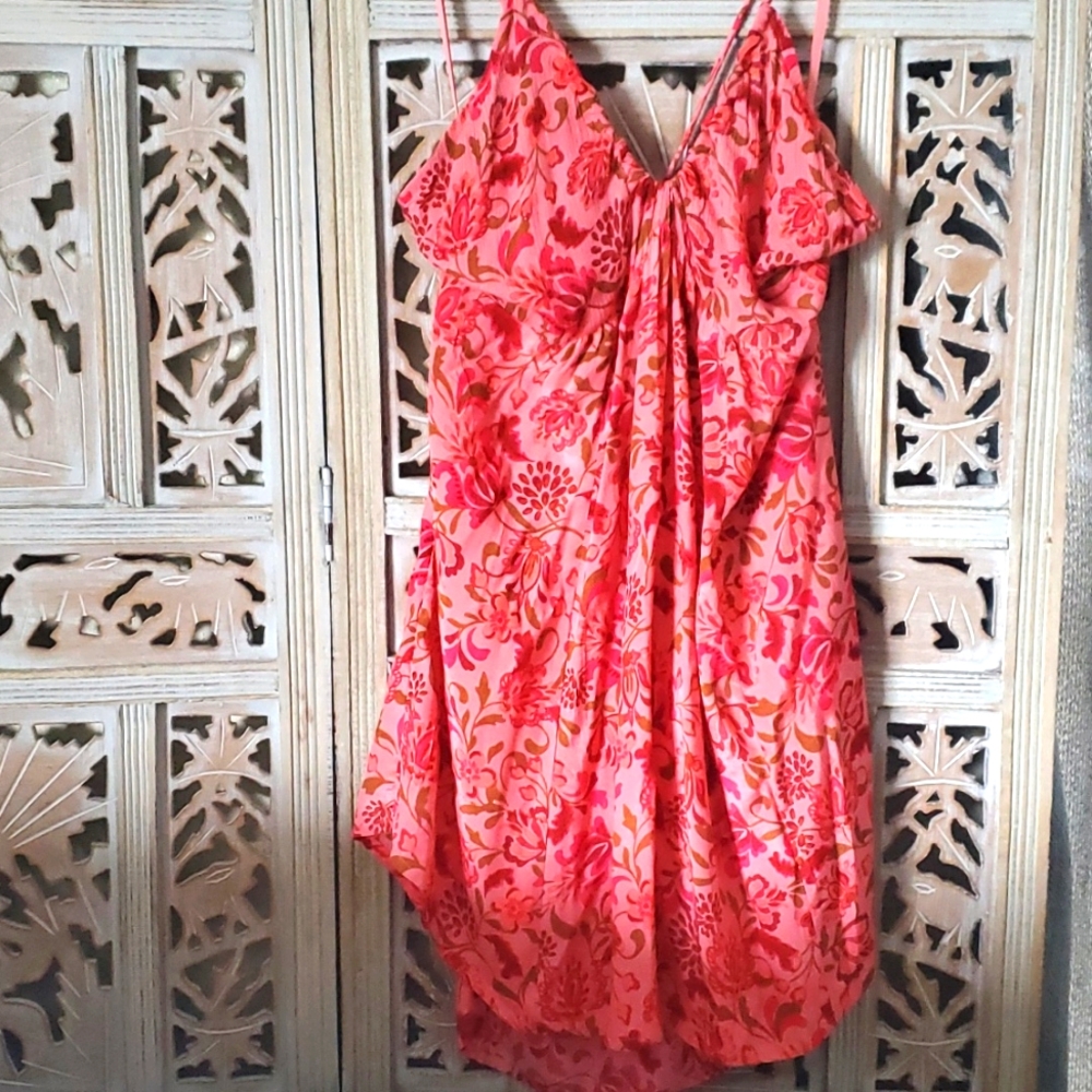 Free People sundress, beautiful material with great fit, metal tassels in back.